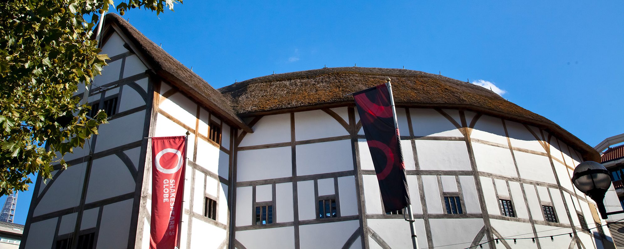 A round thatched theatre on a sunny day