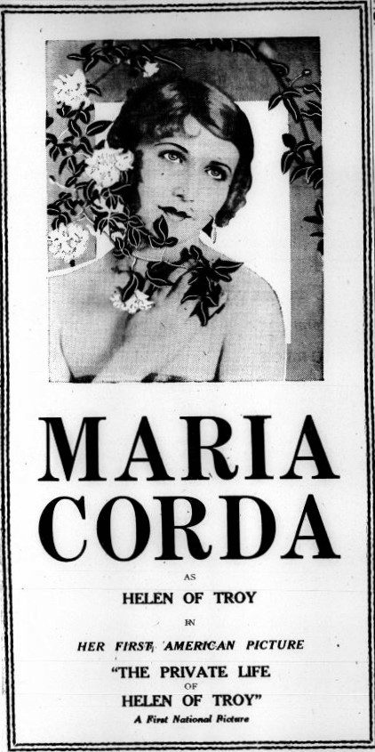 A black-and-white poster with an image of a woman with curled hair holding a vine of flowers and ivy, and the text 'Maria Corda as Helen of Troy in her first American picture The Private Life of Helen of Troy'